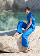 Lange Hose NAJUPI mit Gummibund, seitlichen Eingrifftaschen, weitem Bein und strukturiertem Stoff in Blau 